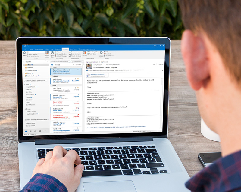 Microsoft Outlook with Mimecast email security plugin displayed on a laptop